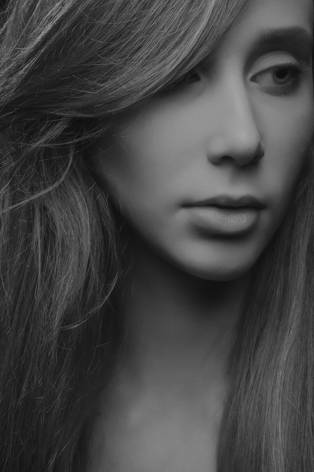 Portrait of a young woman with long hair